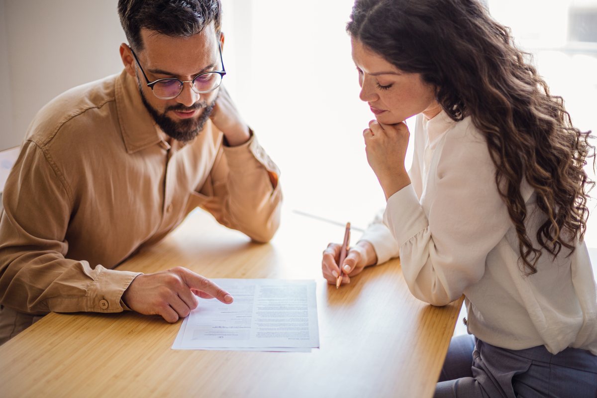 A VAT specialist and a college finance manager going through records together